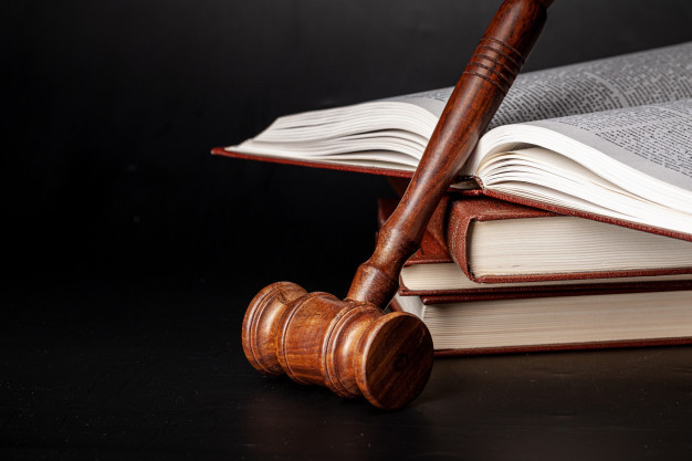 wooden-gavel-juridical-books-close-up_93675-69432